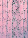 Floral curtains lit in pink and green